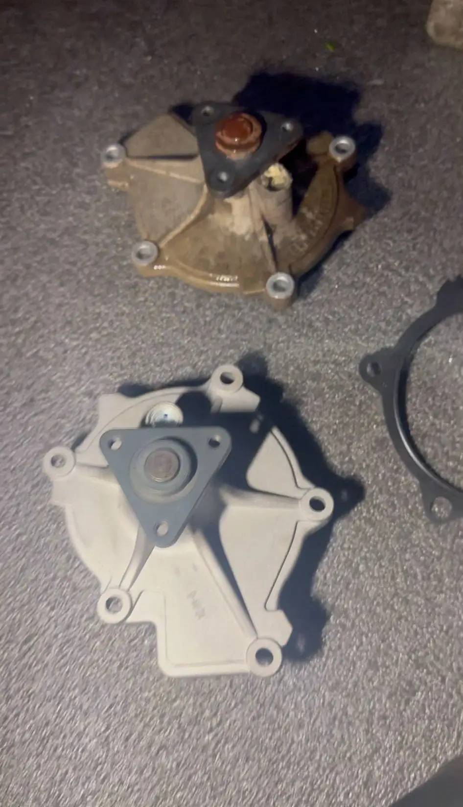 man servicing a car engine