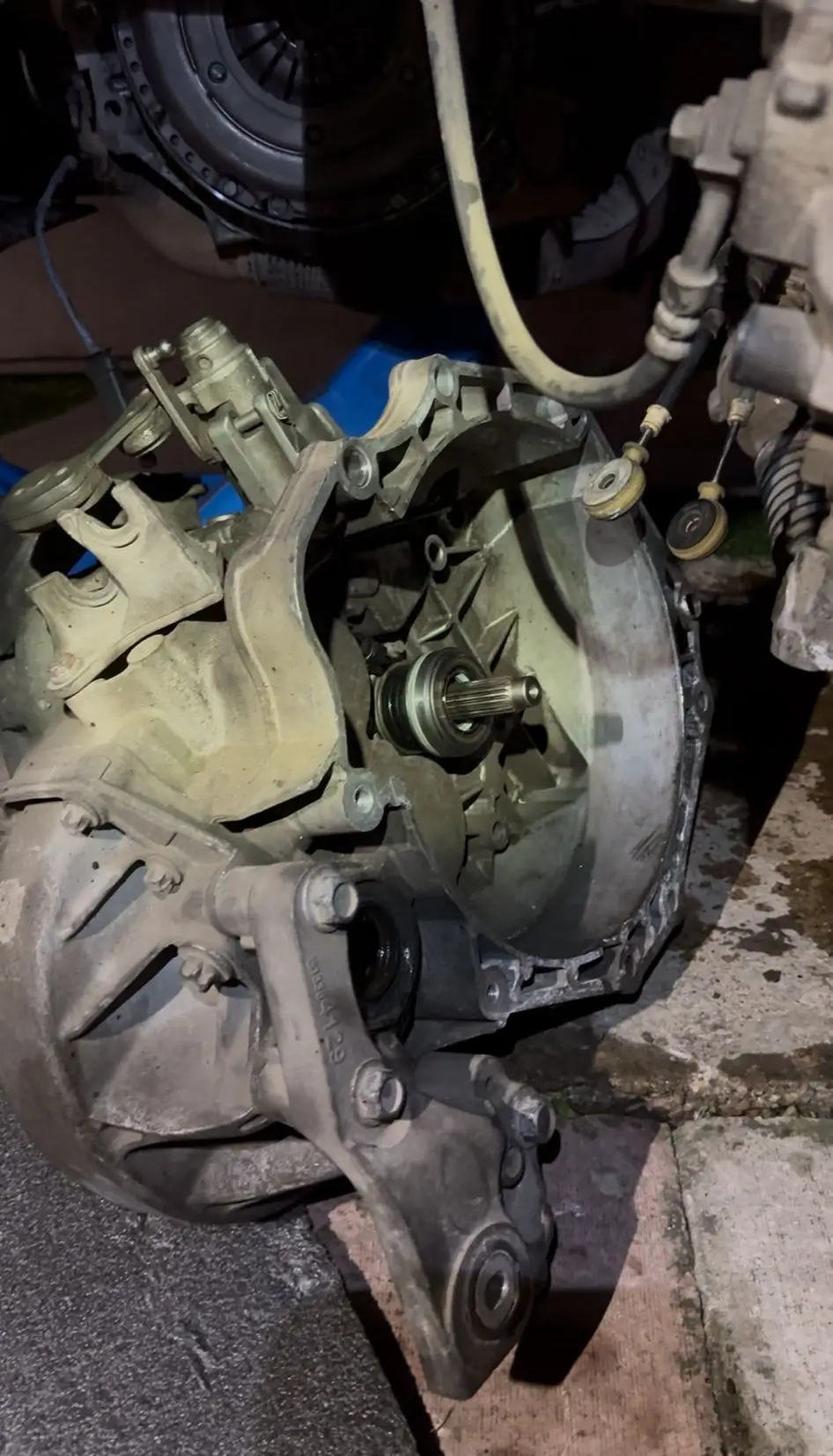 man servicing a car engine